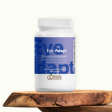 Supplement bottle labeled 'Eye-Adapt' by Healthy Goods on a wooden surface with a white background