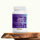 Supplement bottle labeled 'Serene Dreamz' on a wooden surface with a white background