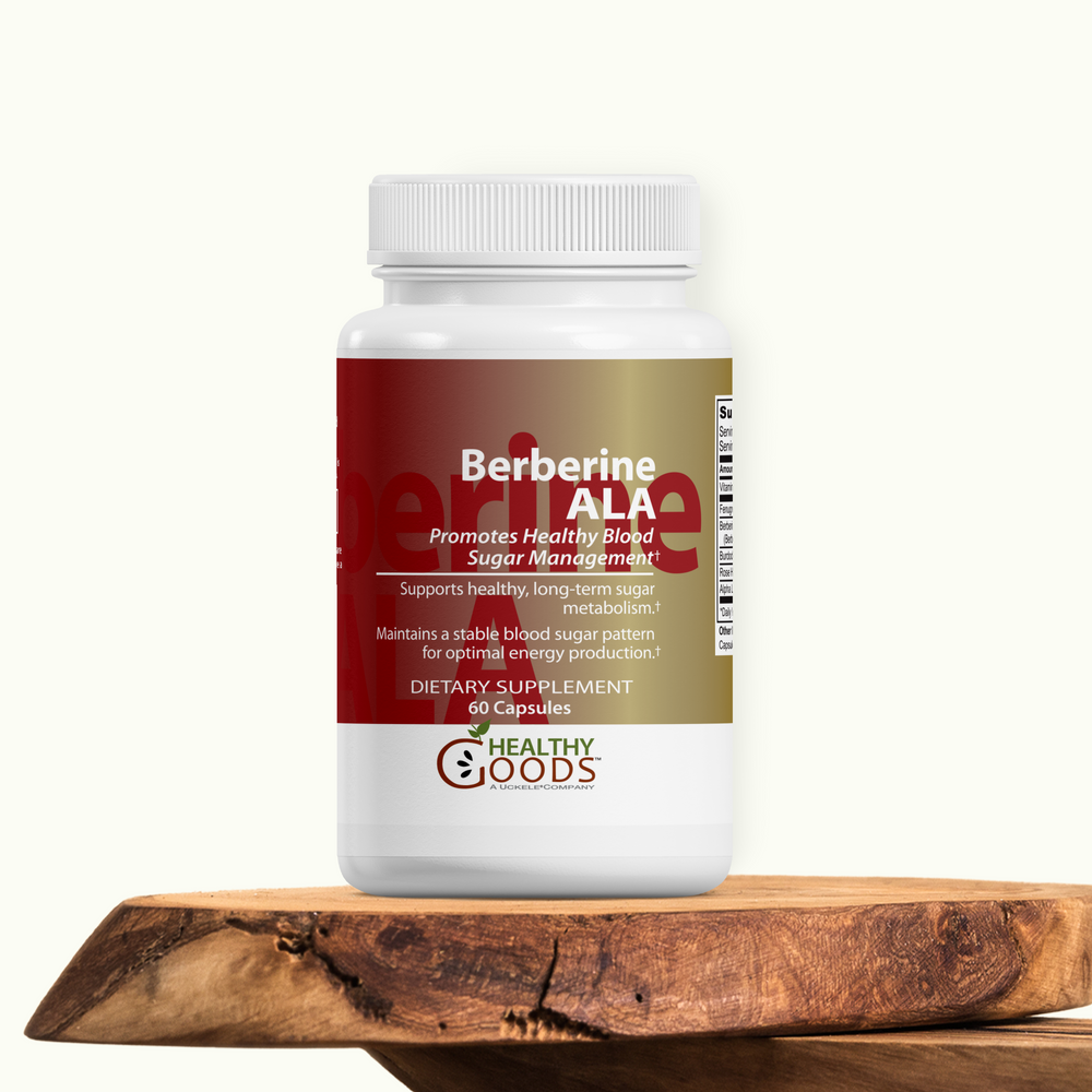 Supplement bottle labeled 'Berberine ALA' on a wooden surface with a white background