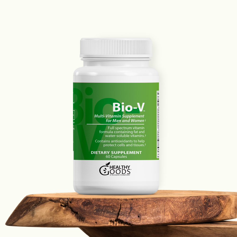 White supplement bottle labeled 'Bio-V' on a wooden surface with a white background