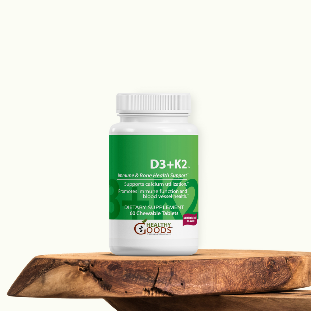 Supplement bottle labeled 'D3+K2' on a wooden surface with a white background