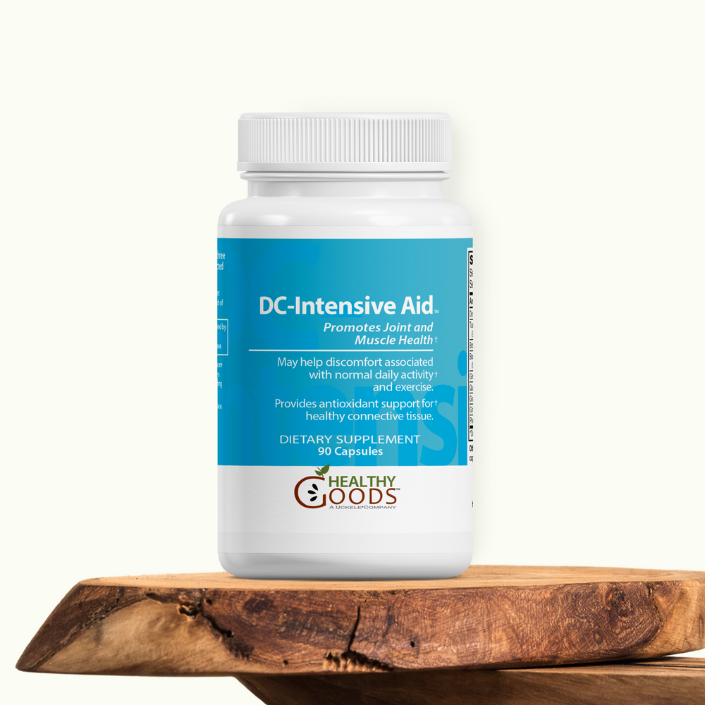 Supplement bottle labeled 'DC-Intensive Aid' on a wooden surface with a white background