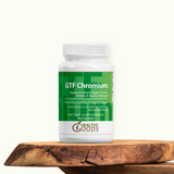 Supplement bottle labeled 'GTF Chromium' by 'Healthy Goods' on a wooden surface with a white background
