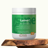 Dietary supplement container labeled 'Lysine C' on a wooden surface with a white background