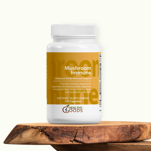 Supplement bottle labeled 'Mushroom Immune' by Healthy Goods on a wooden surface with a white background