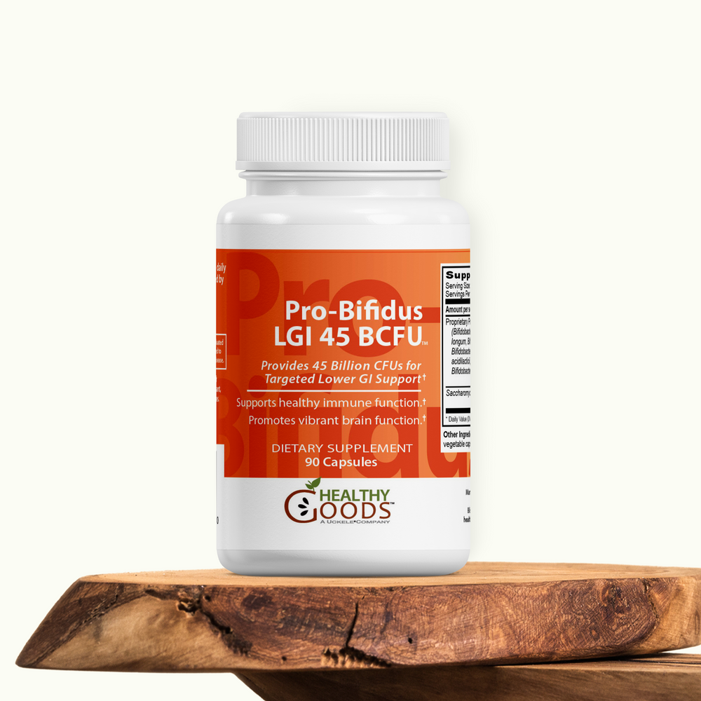 Probiotic supplement bottle labeled 'Pro-Bifidus LGI 45 BCFU' on a wooden surface with a white background