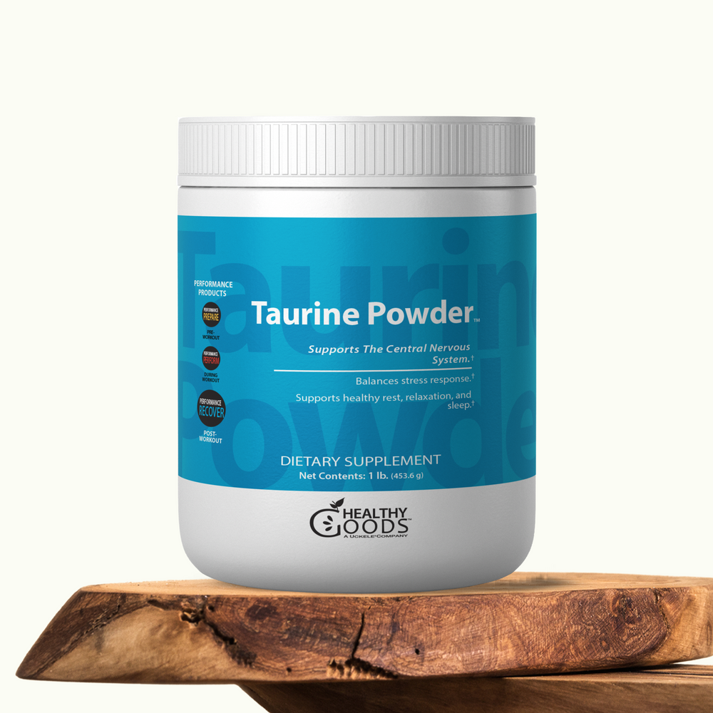 Container of Taurine Powder by Healthy Goods on a wooden surface with a white background
