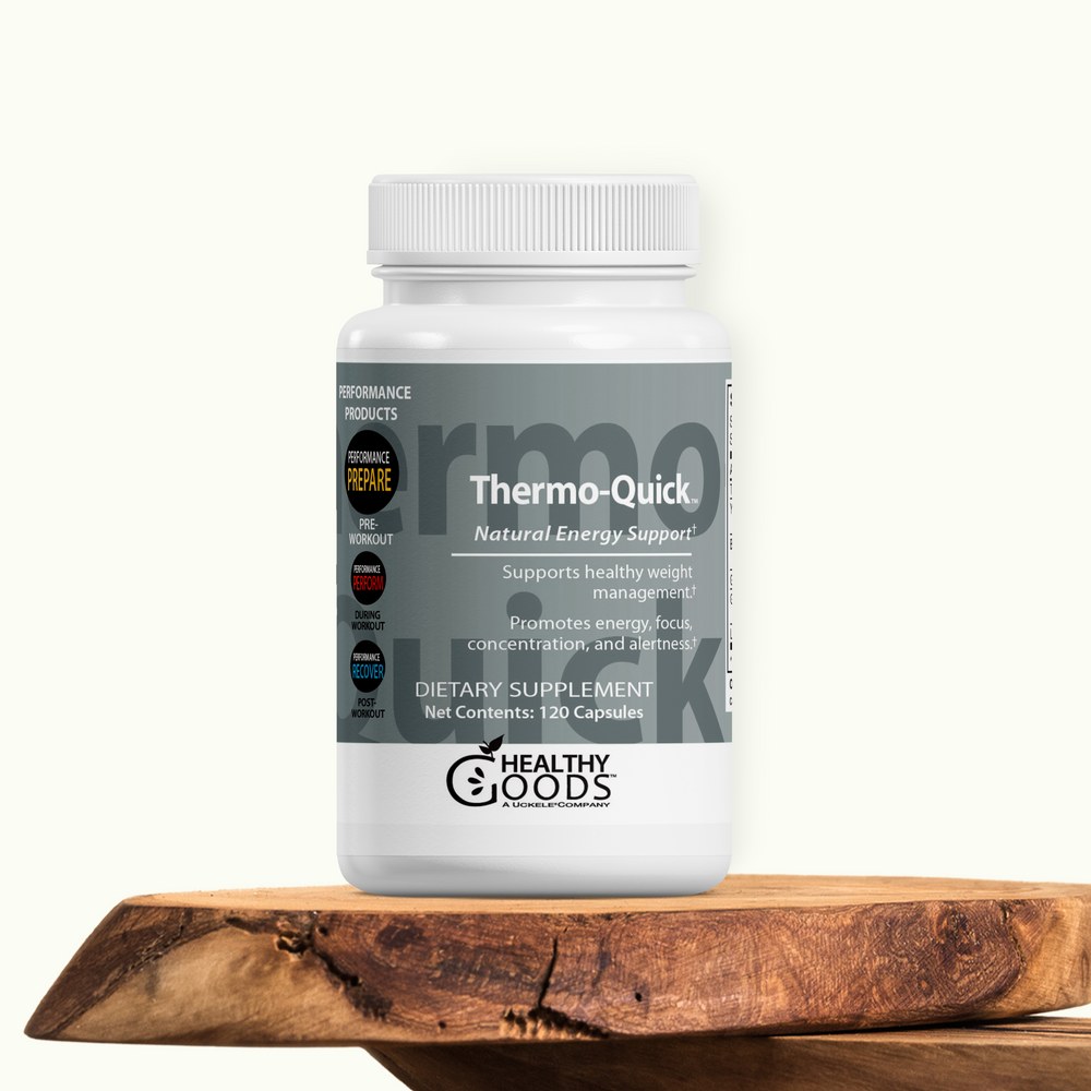 Supplement bottle labeled 'Thermo-Quick' on a wooden surface with a white background