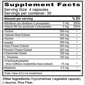 A close-up of a supplement facts label showing a black-and-white table with serving size 4 capsules, vitamins, amino acids, and other ingredients including valerian root, chamomile & melatonin